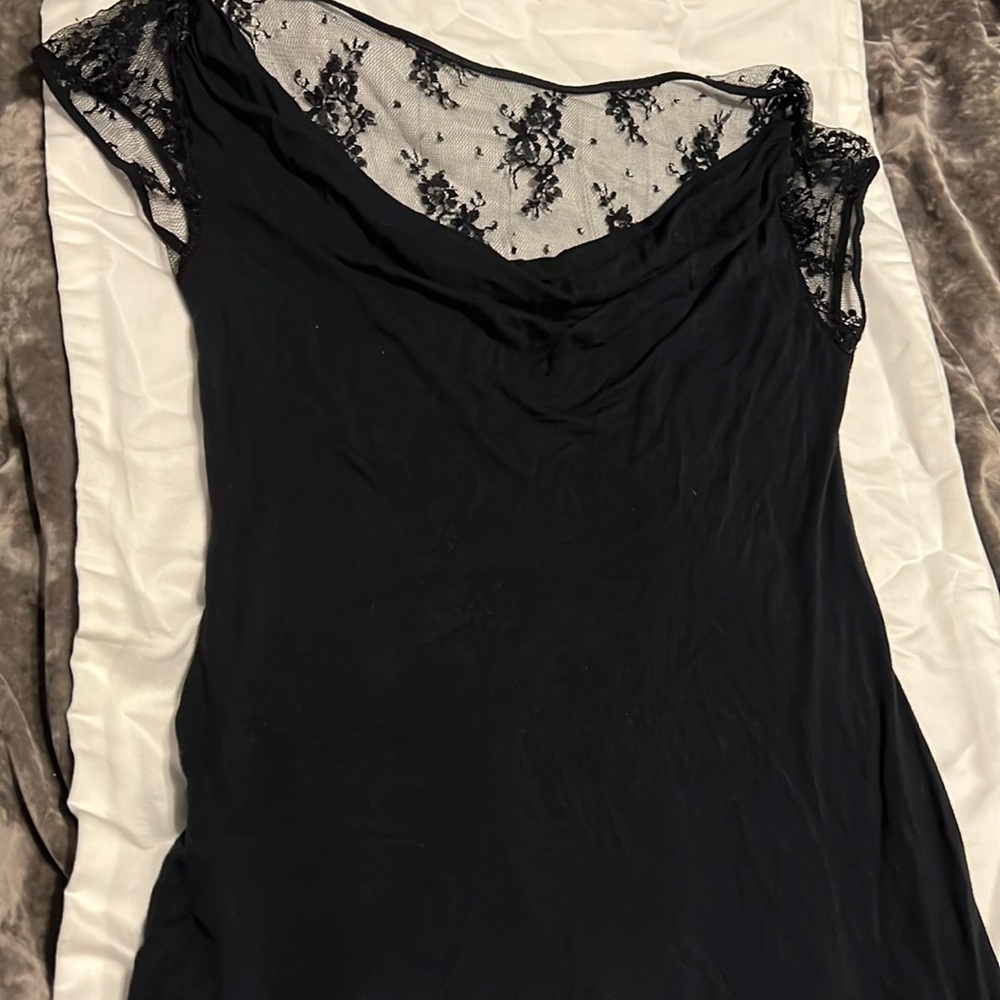 Super cute small black express shirt. Lacey too back and sleeve.